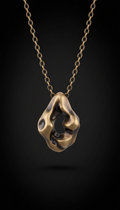 Smoked bronze sculptural pendant necklace